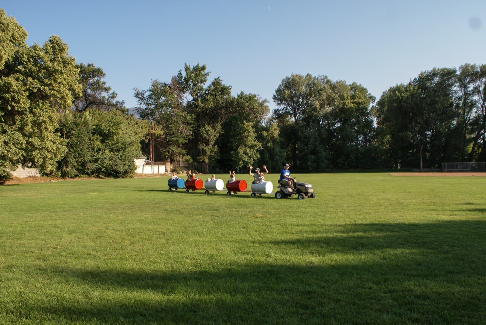 Kids riding the barrel train