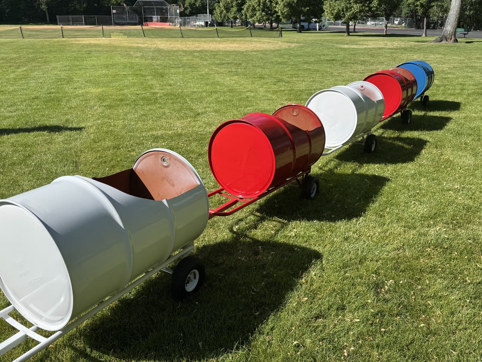 The Backyard Barrel Express barrel train set up on the grass