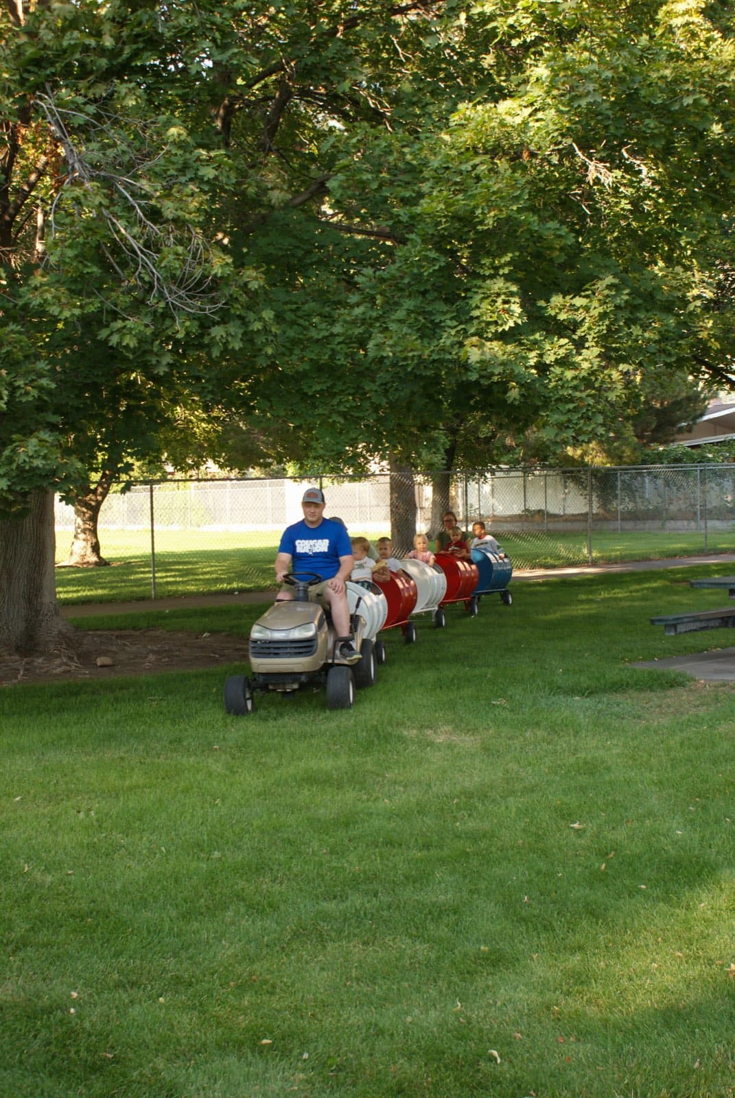 Kids riding the Backyard Barrel Express