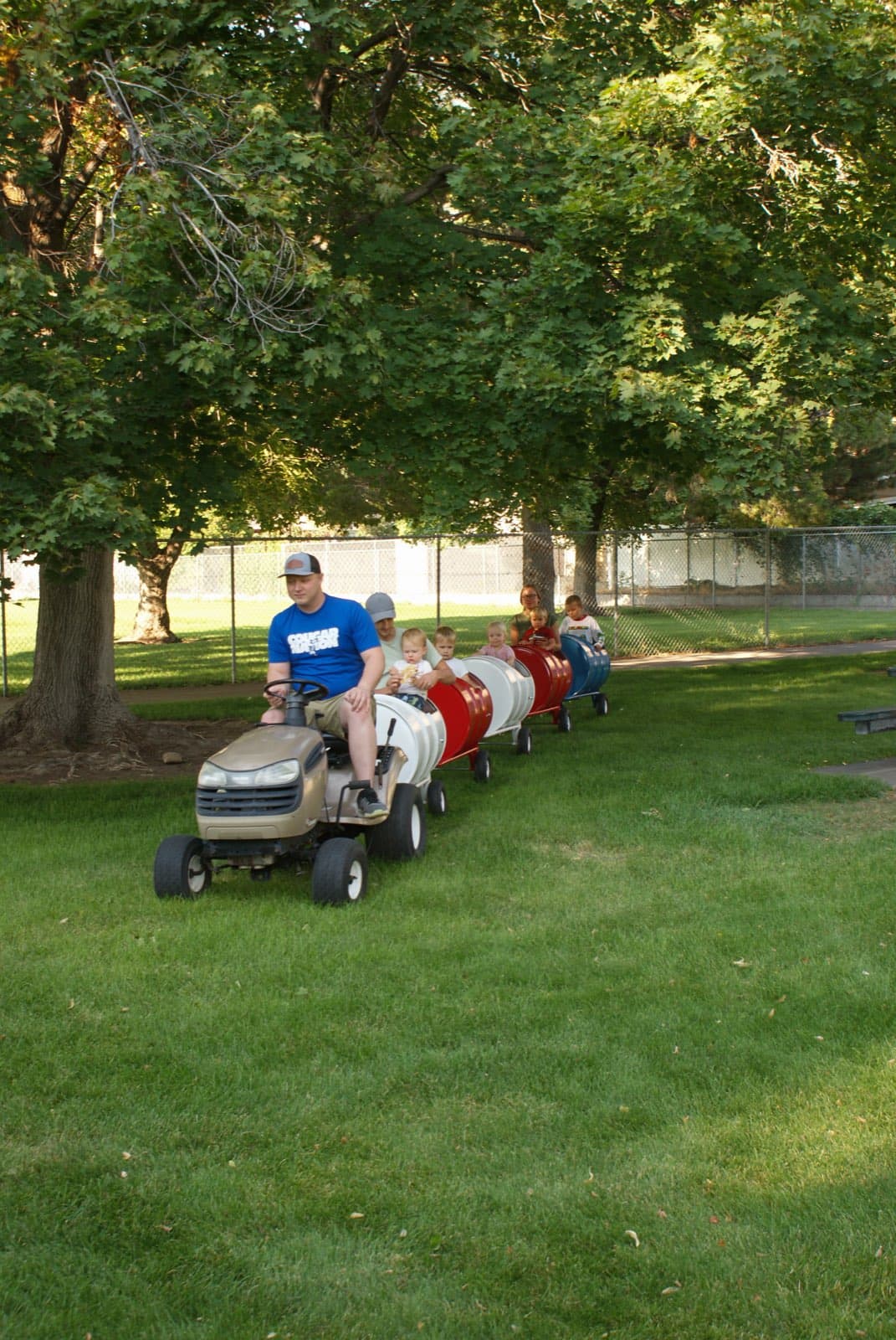Kids riding the Backyard Barrel Express