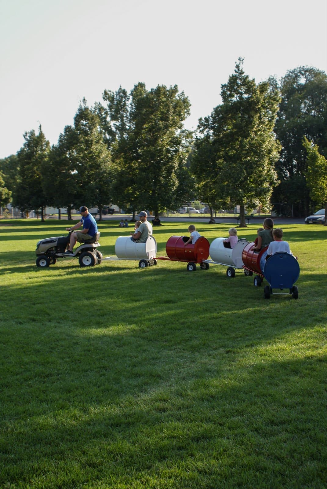 Kids riding the Backyard Barrel Express