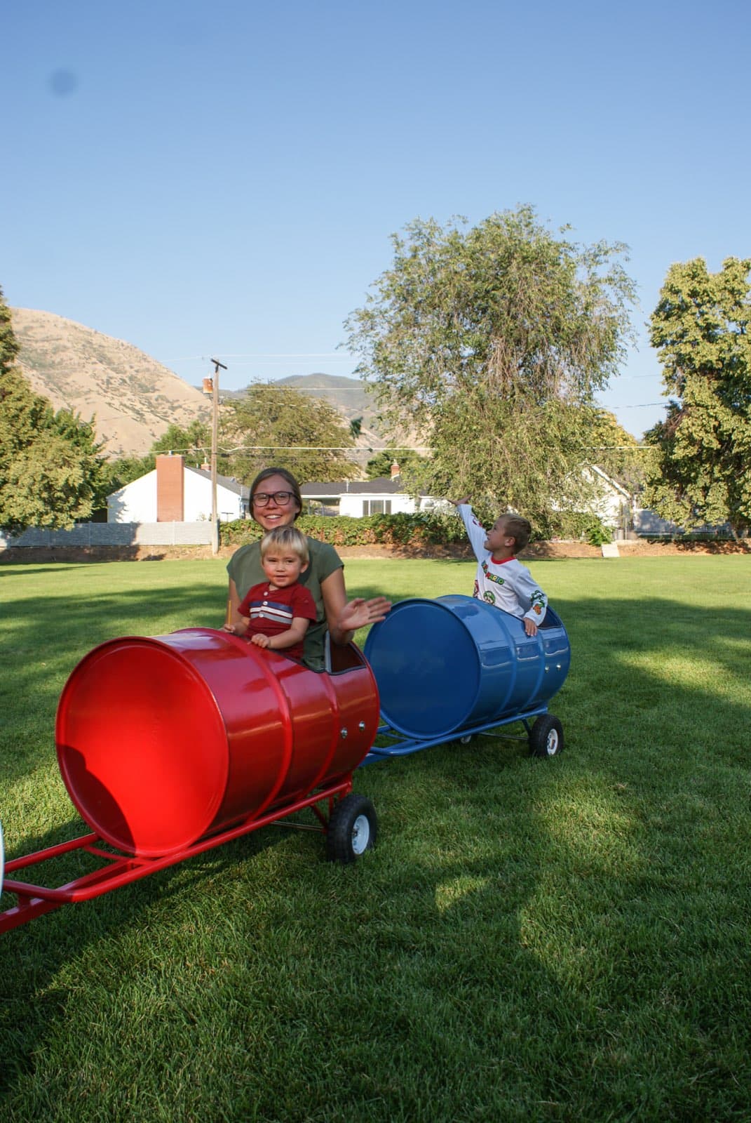 Kids riding the Backyard Barrel Express