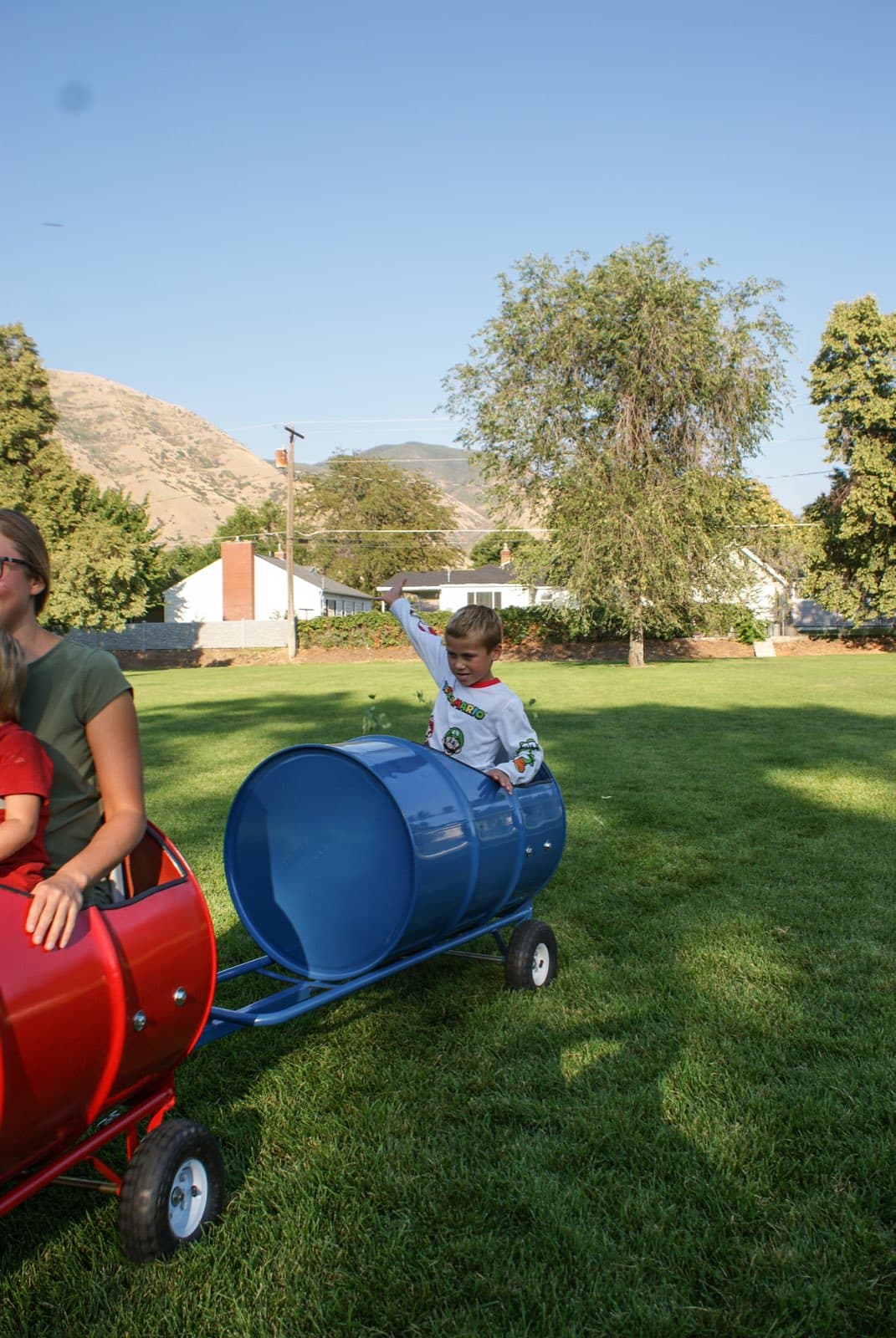 Kids riding the Backyard Barrel Express