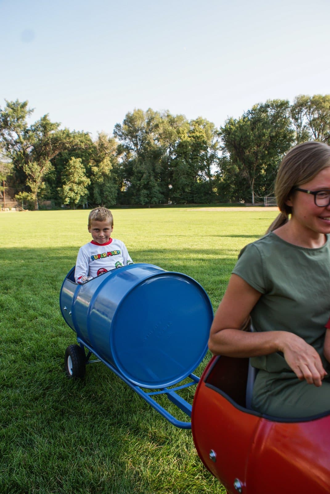 Kids riding the Backyard Barrel Express