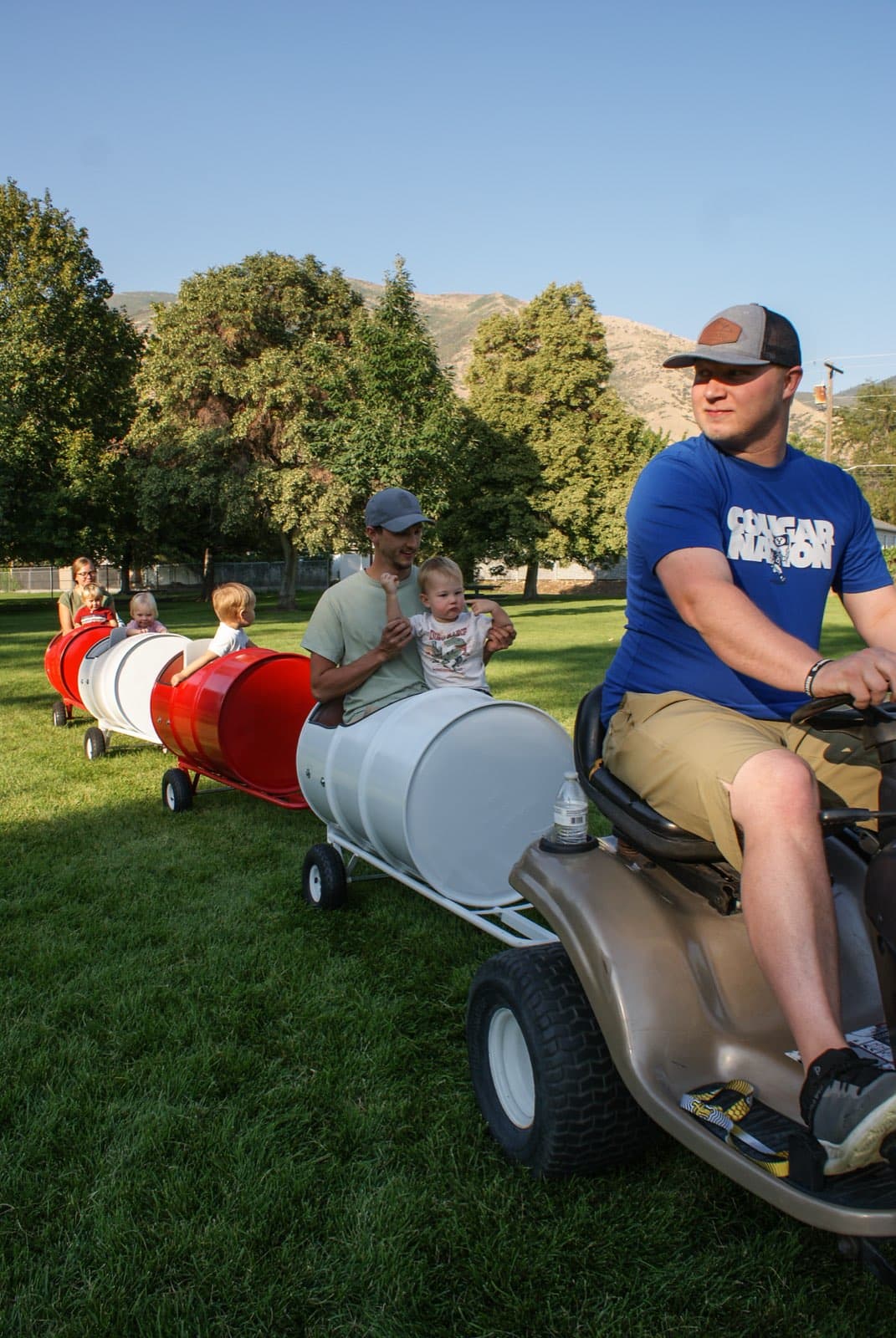Kids riding the Backyard Barrel Express