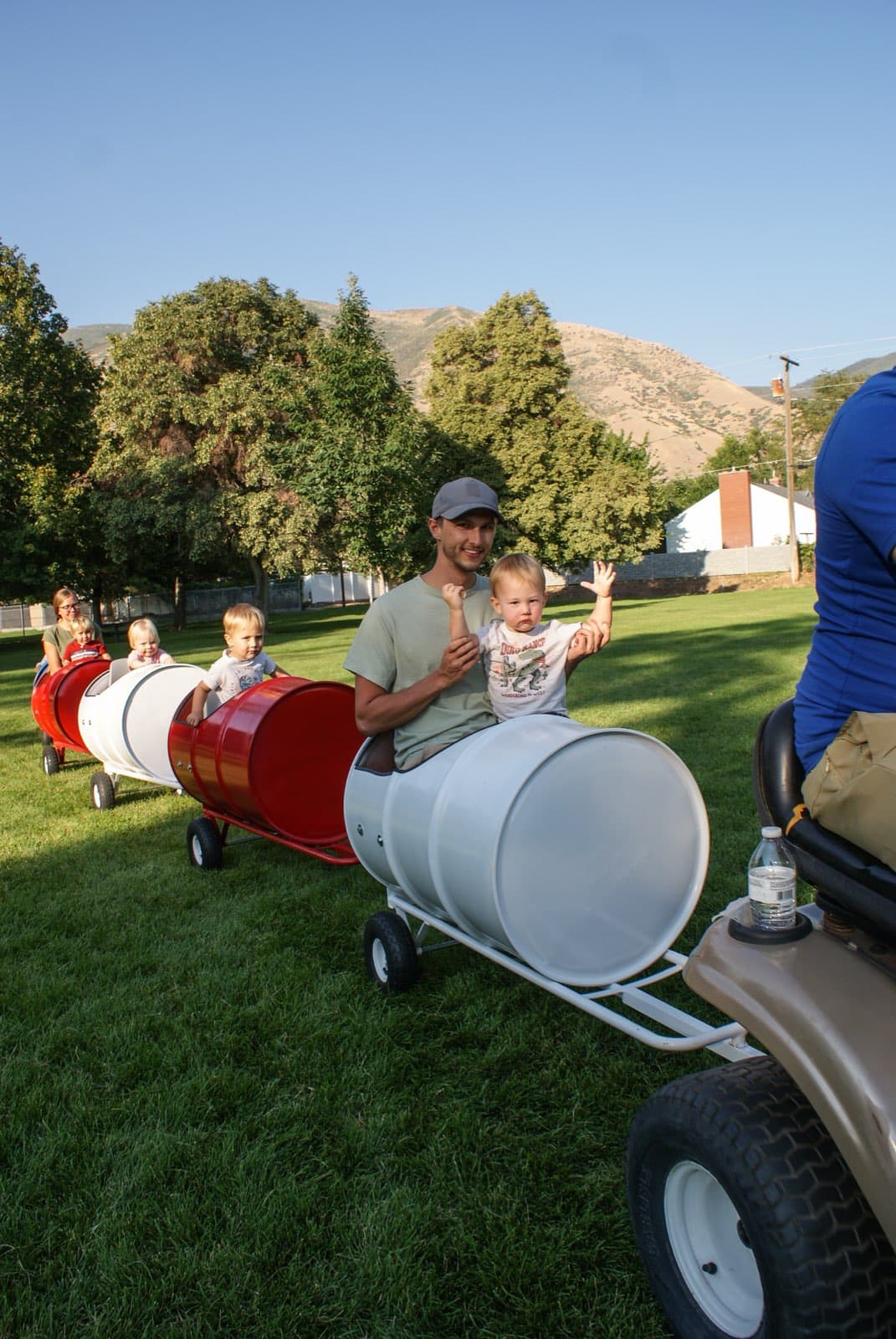 Kids riding the Backyard Barrel Express