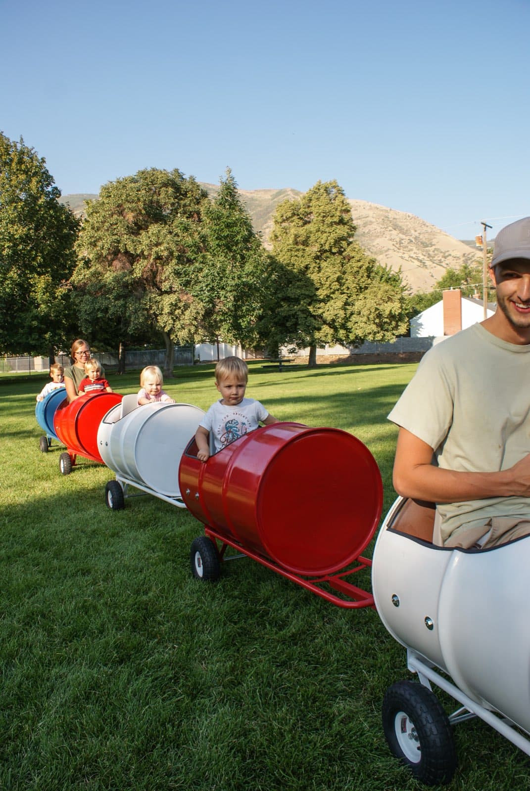 Kids riding the Backyard Barrel Express