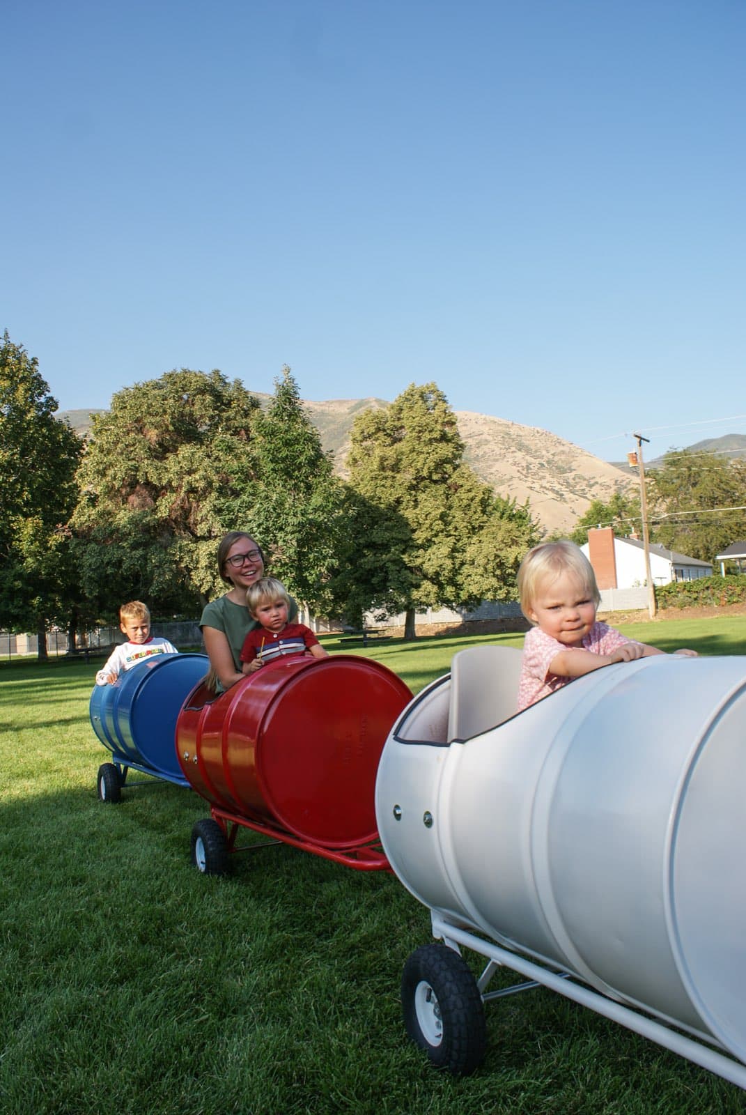 Kids riding the Backyard Barrel Express