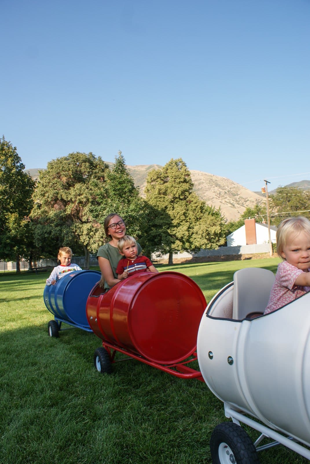 Kids riding the Backyard Barrel Express