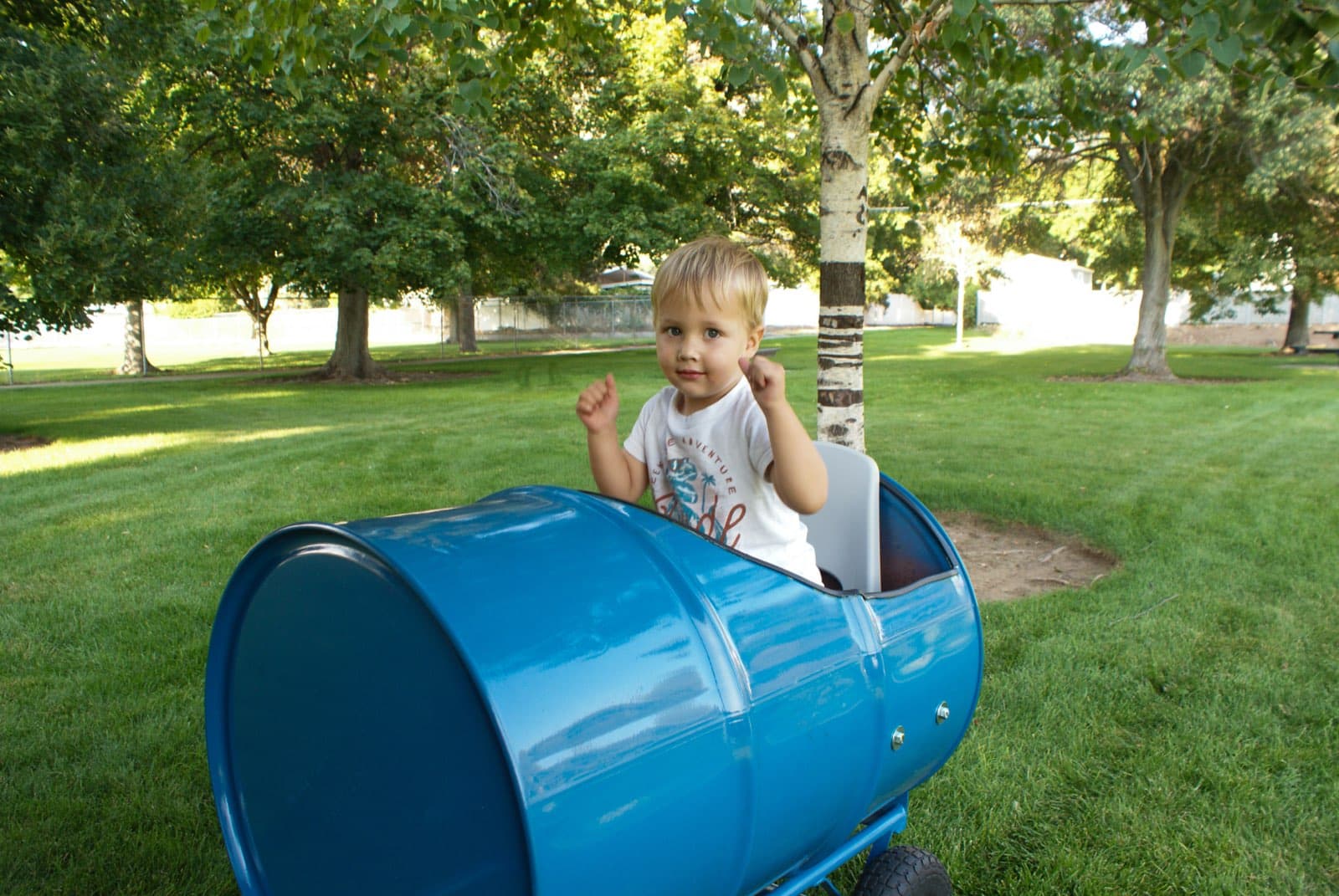 Kids riding the Backyard Barrel Express