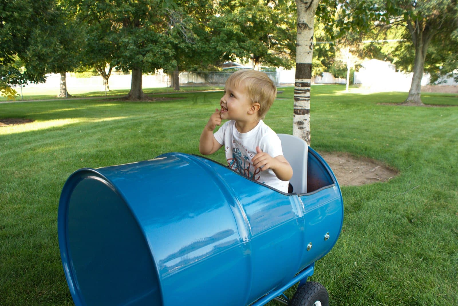 Kids riding the Backyard Barrel Express