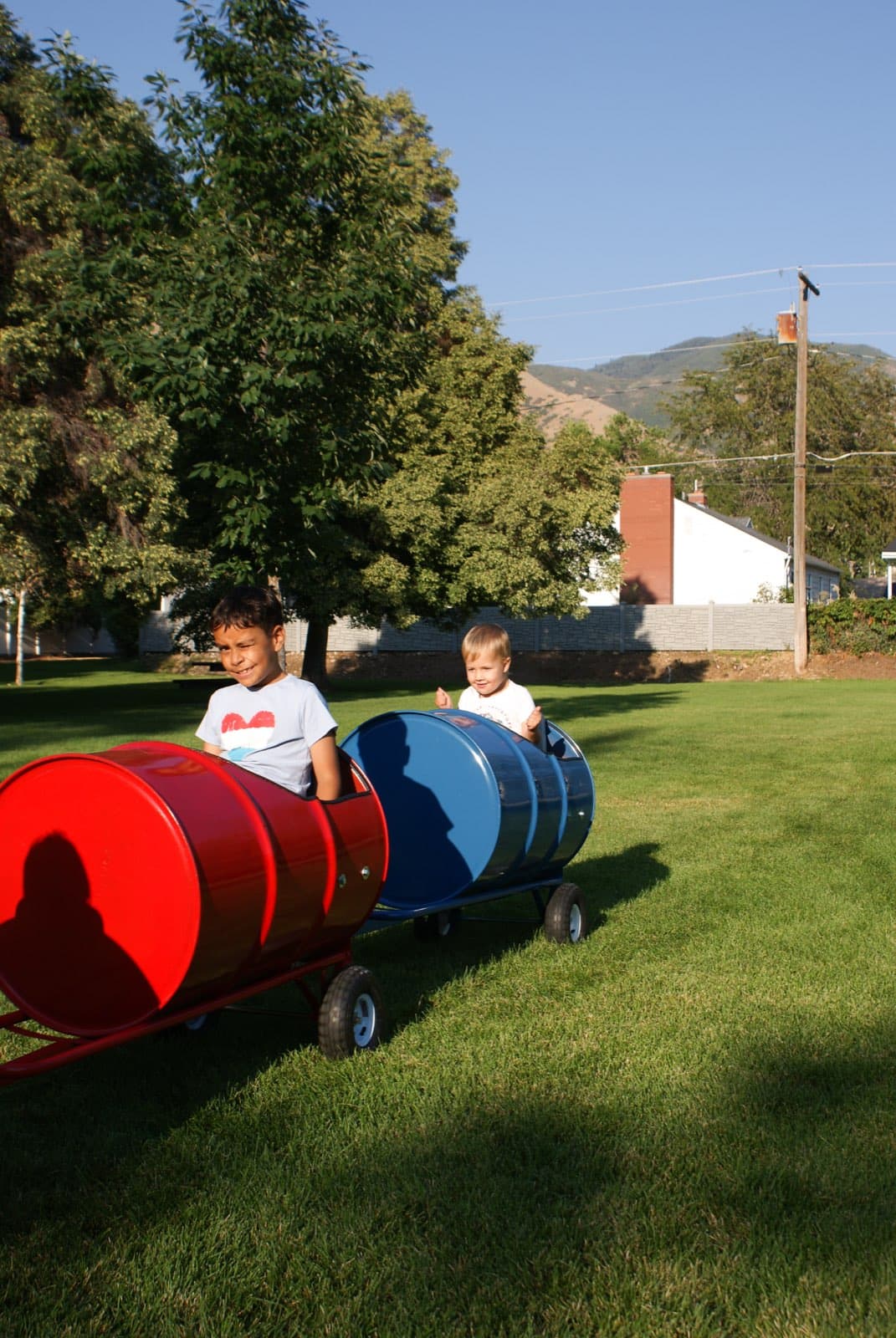 Kids riding the Backyard Barrel Express