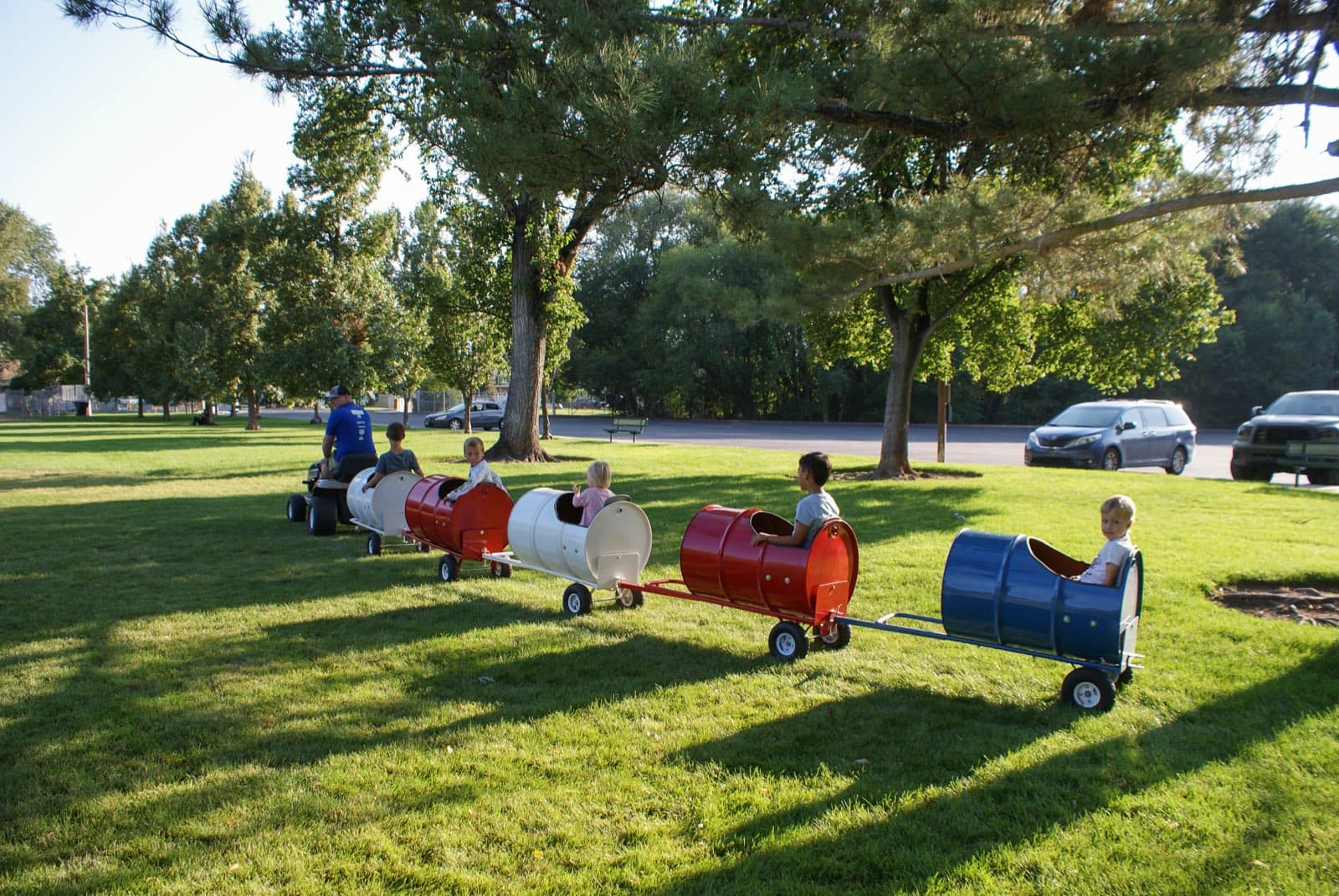 Kids riding the Backyard Barrel Express