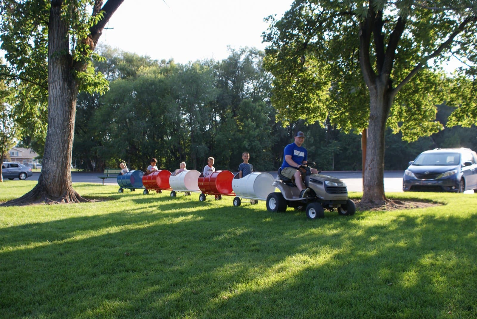 Kids riding the Backyard Barrel Express