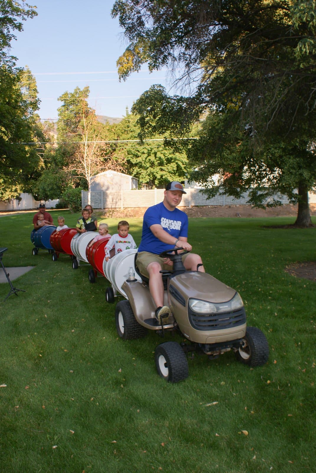 Kids riding the Backyard Barrel Express