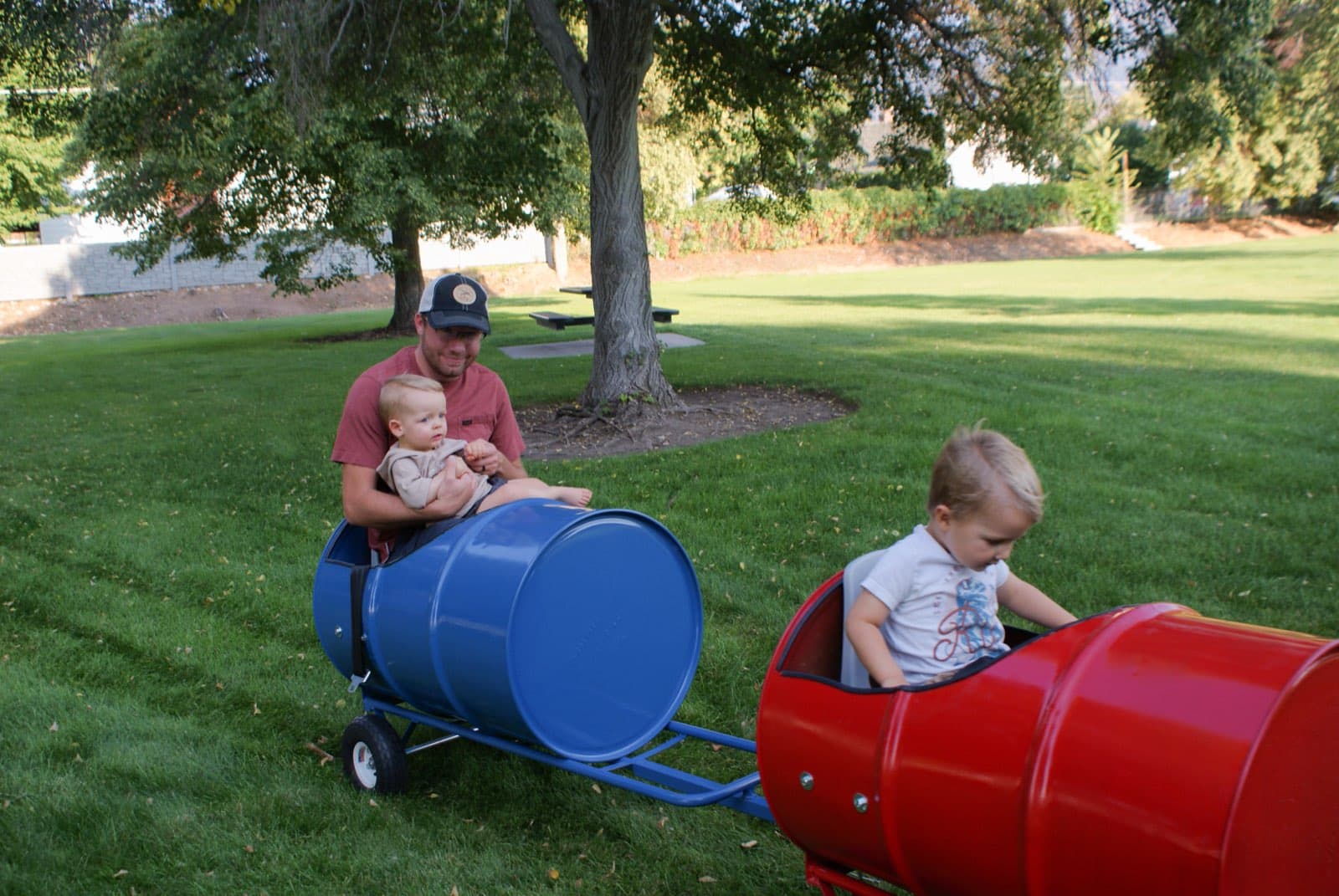 Kids riding the Backyard Barrel Express
