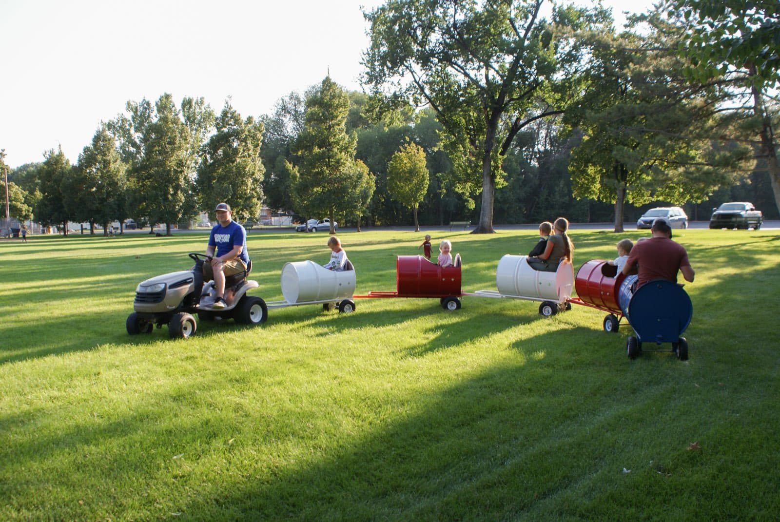 Kids riding the Backyard Barrel Express
