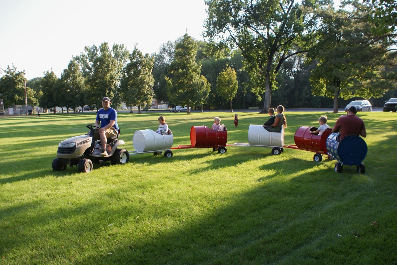Kids riding the Backyard Barrel Express