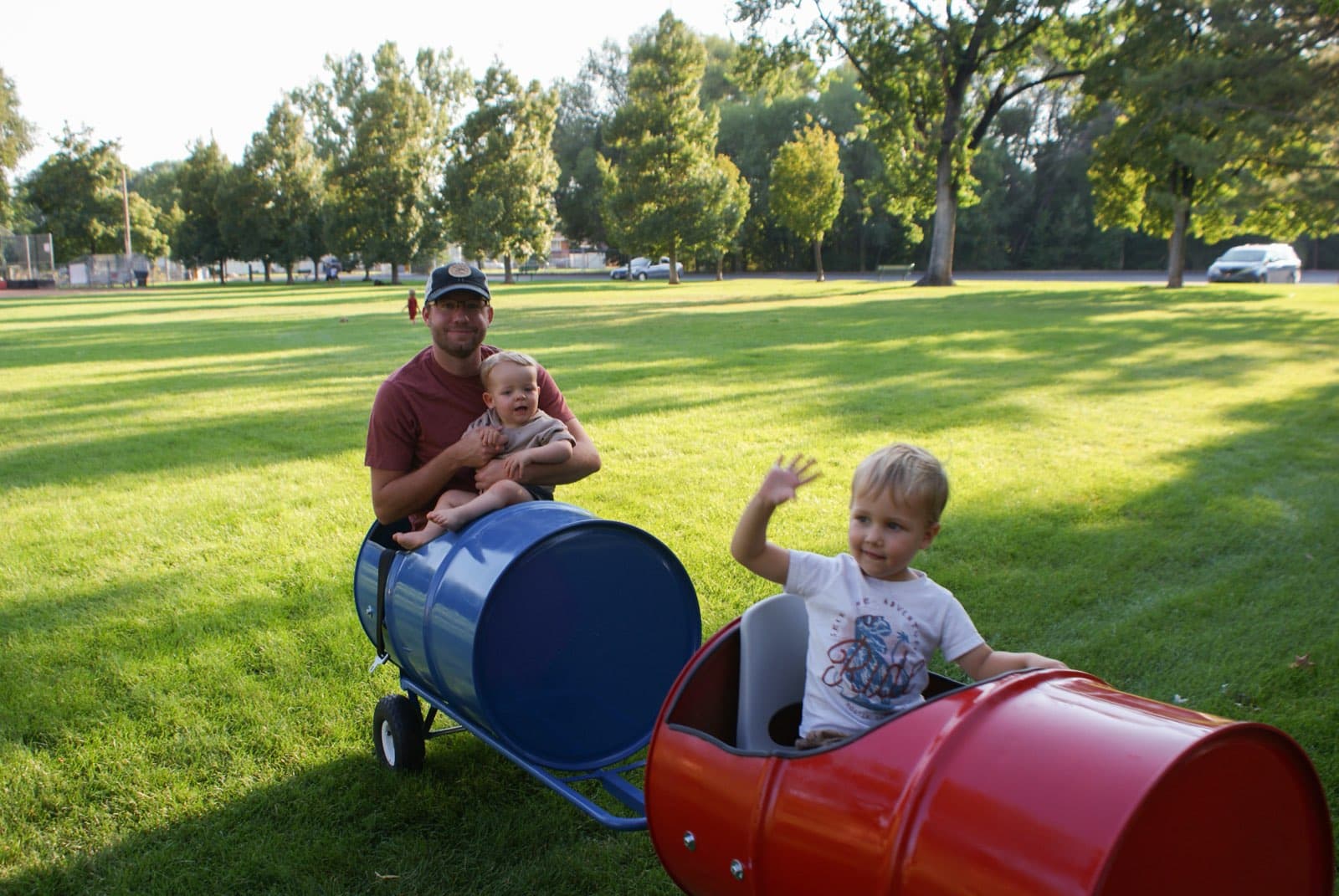 Kids riding the Backyard Barrel Express