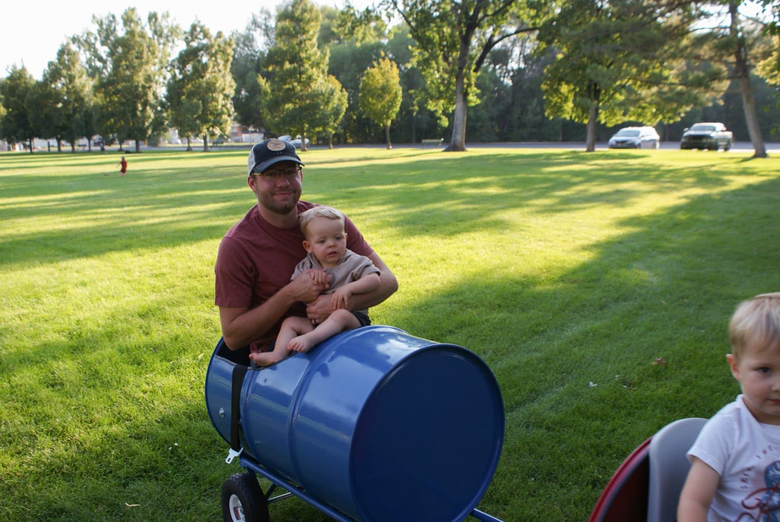 Kids riding the Backyard Barrel Express