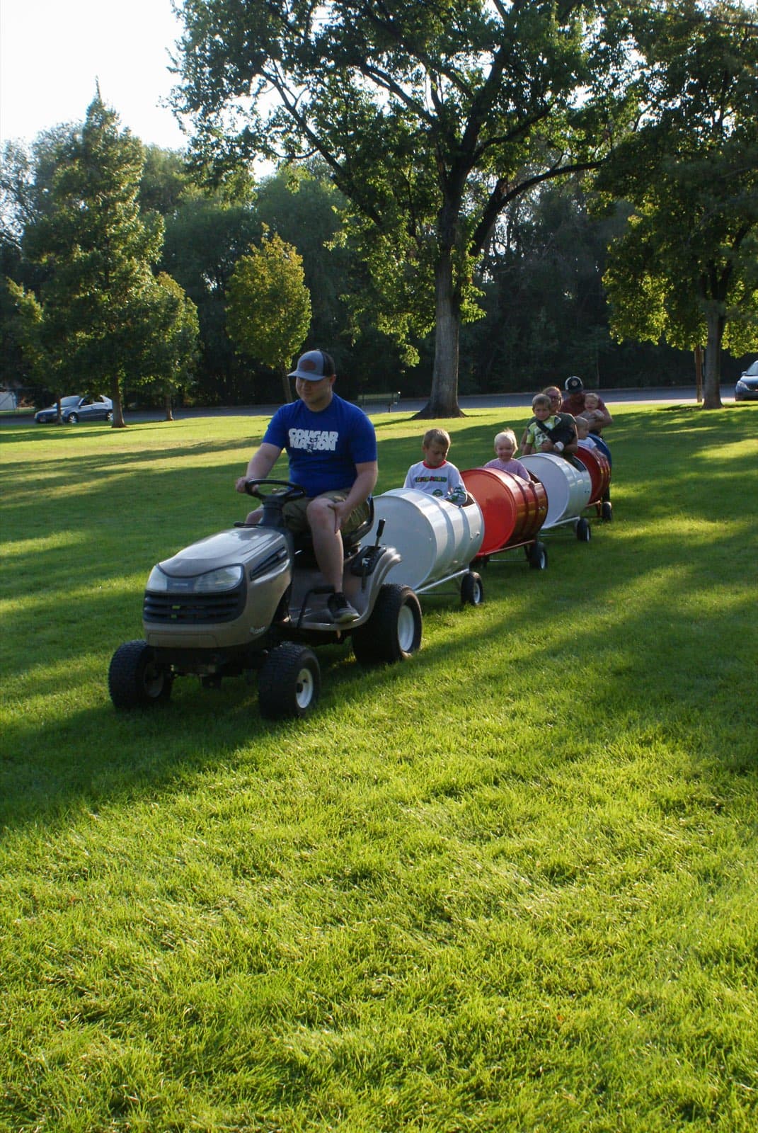Kids riding the Backyard Barrel Express