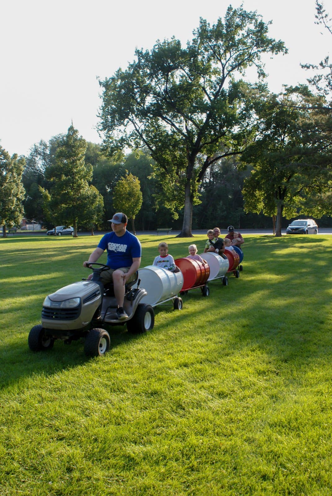 Kids riding the Backyard Barrel Express
