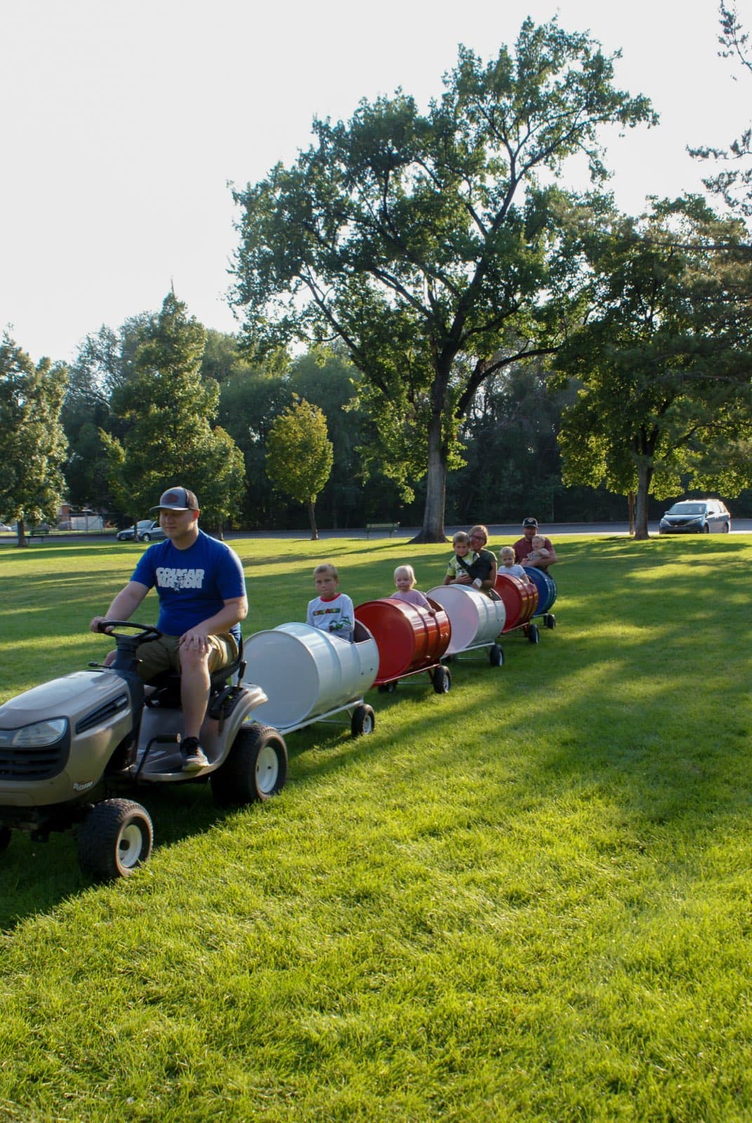 Kids riding the Backyard Barrel Express