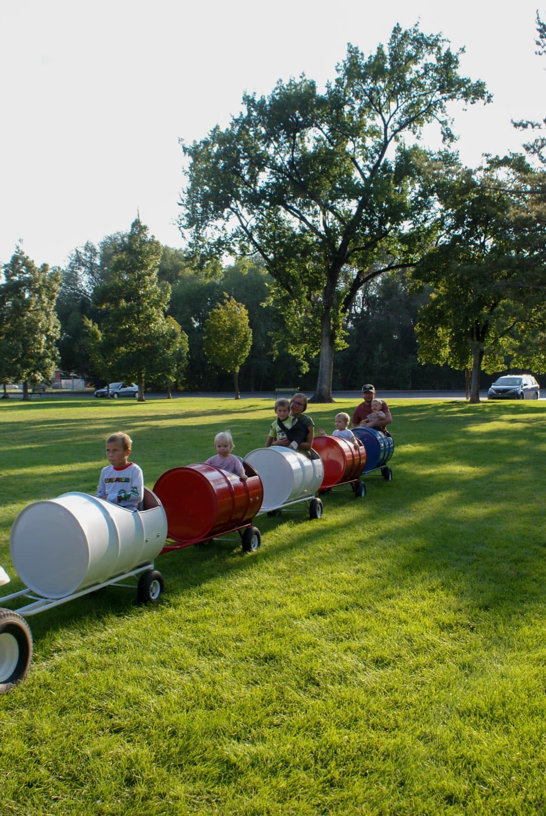 Kids riding the Backyard Barrel Express
