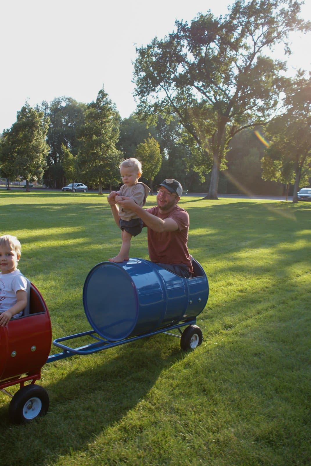 Kids riding the Backyard Barrel Express