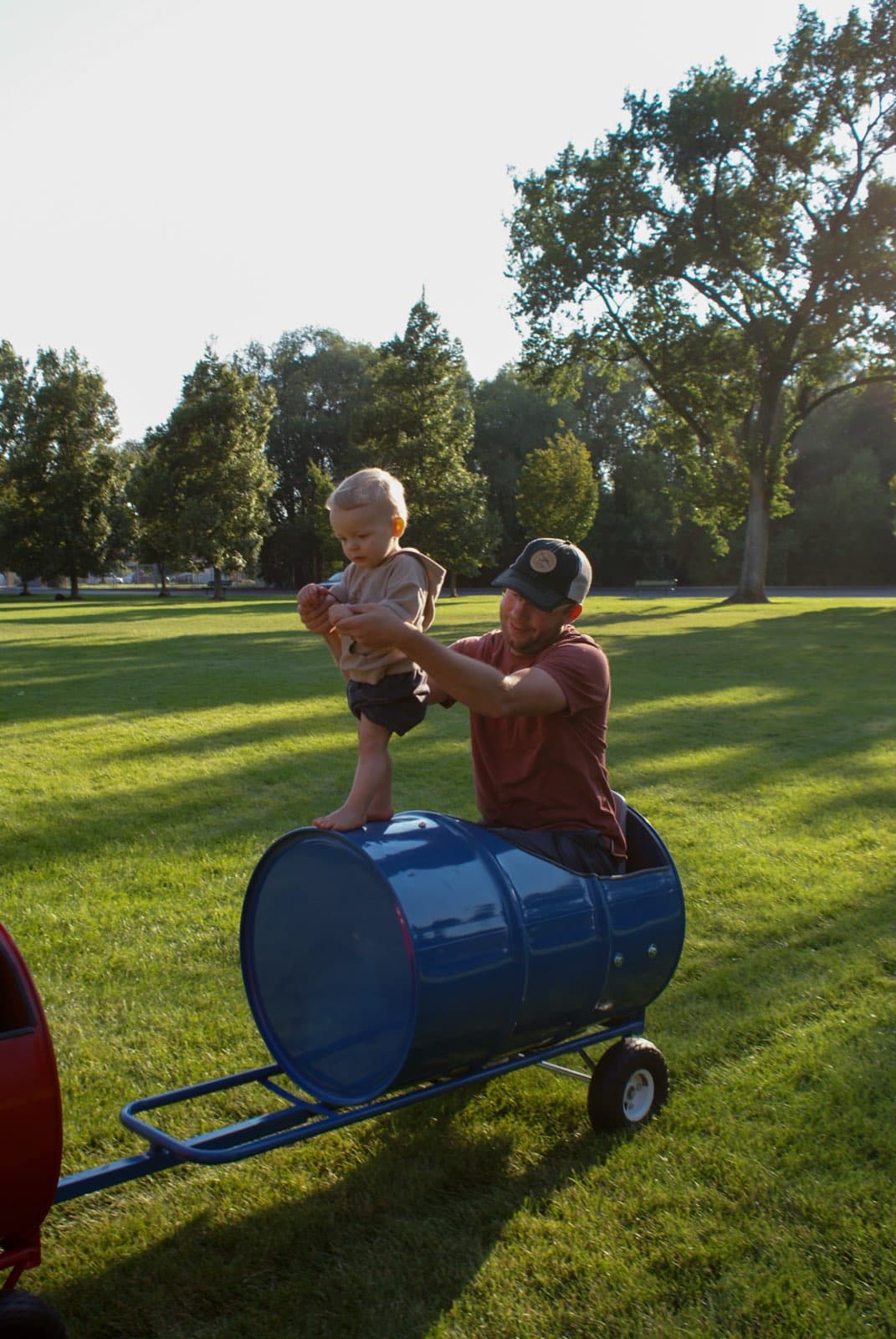 Kids riding the Backyard Barrel Express