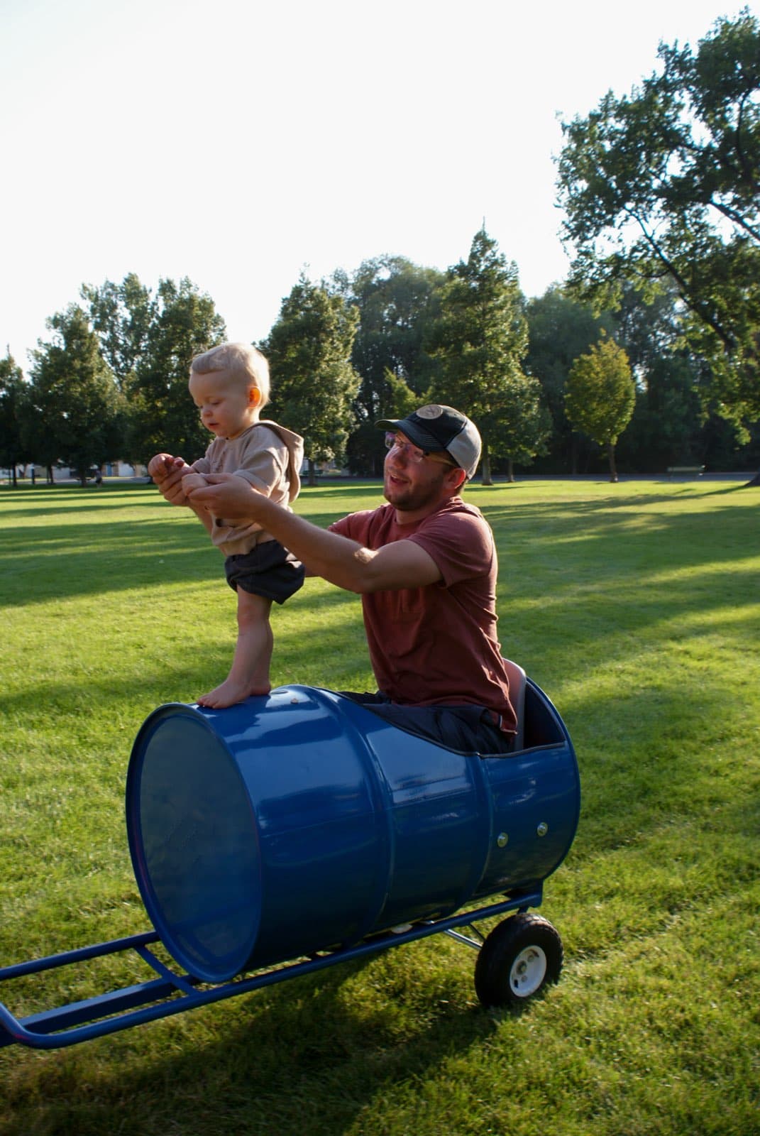 Kids riding the Backyard Barrel Express