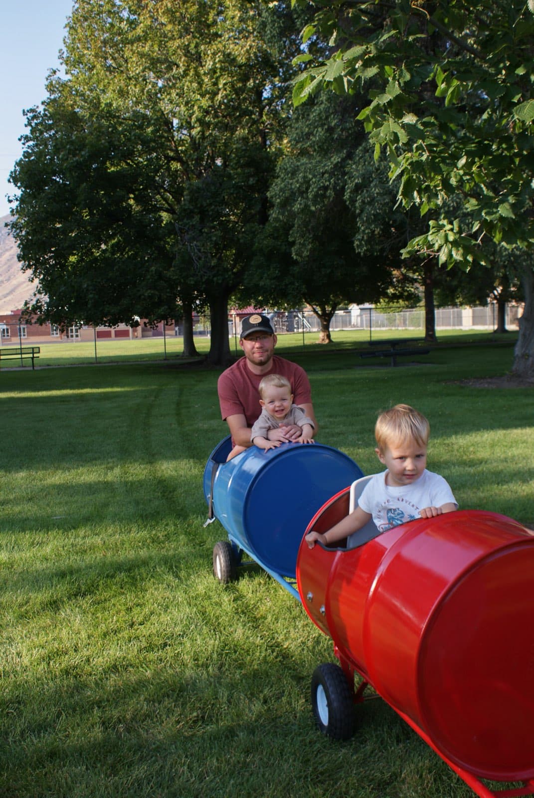 Kids riding the Backyard Barrel Express
