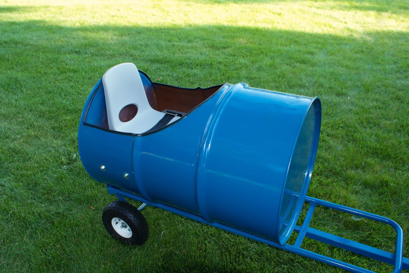 Kids riding the Backyard Barrel Express