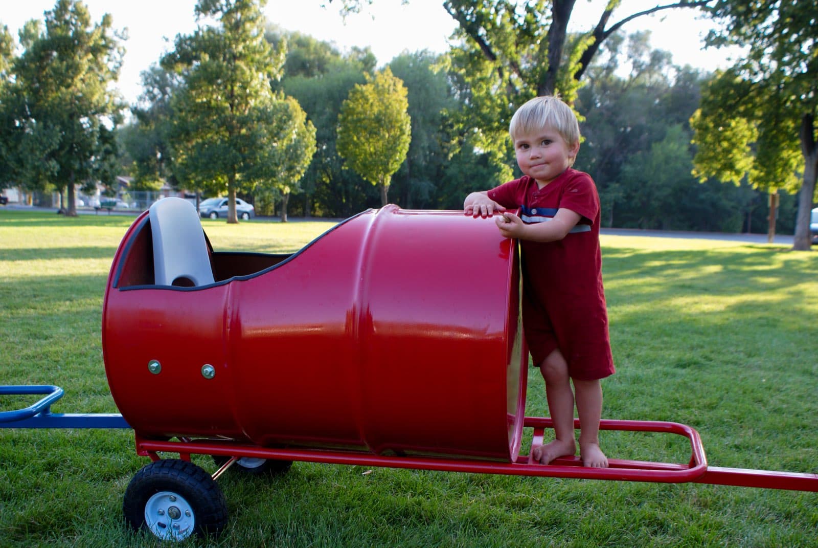 Kids riding the Backyard Barrel Express
