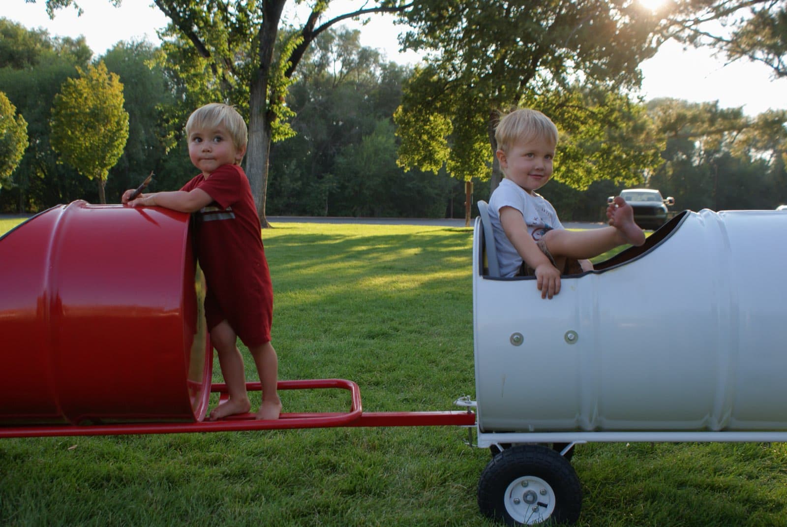 Kids riding the Backyard Barrel Express