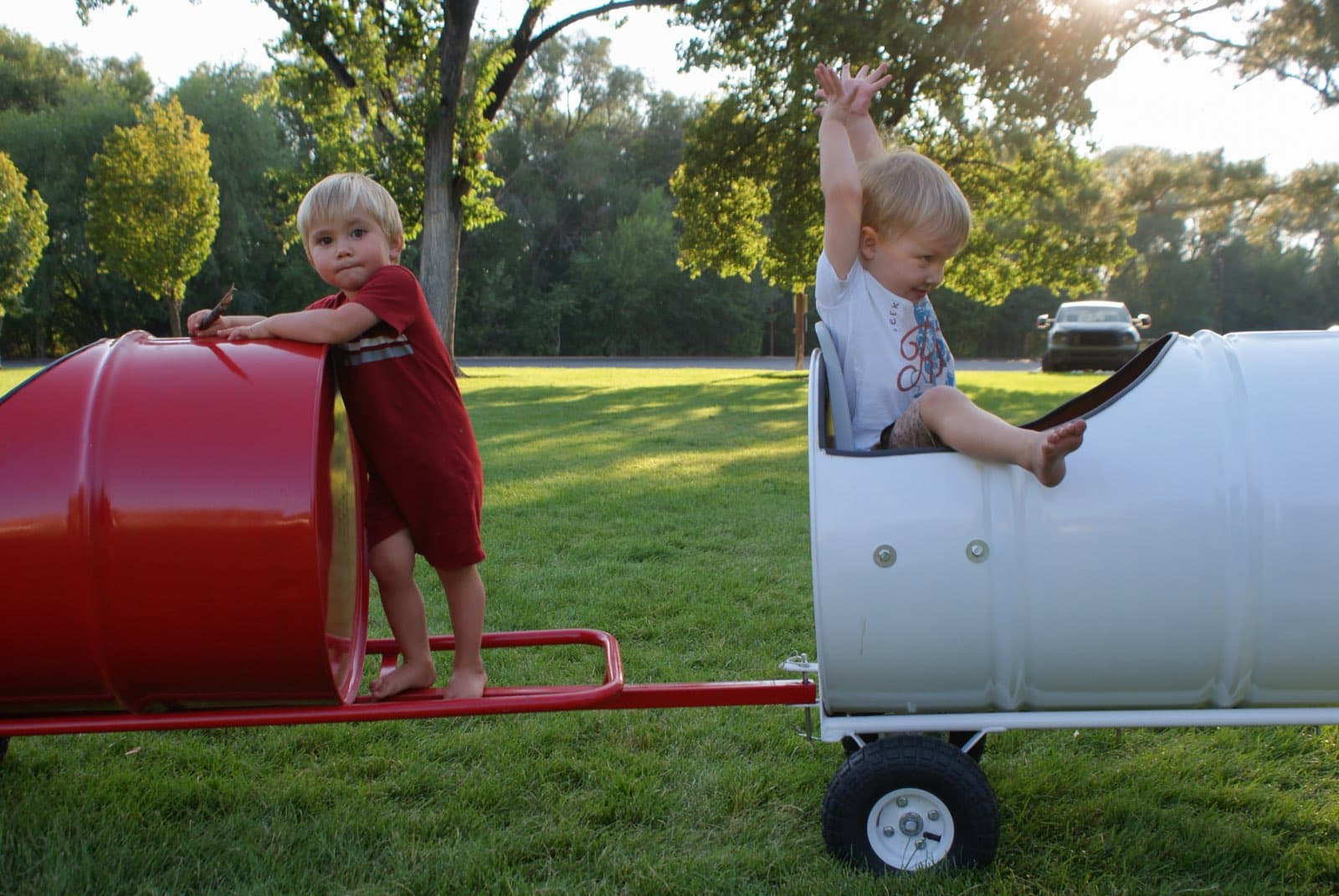 Kids riding the Backyard Barrel Express