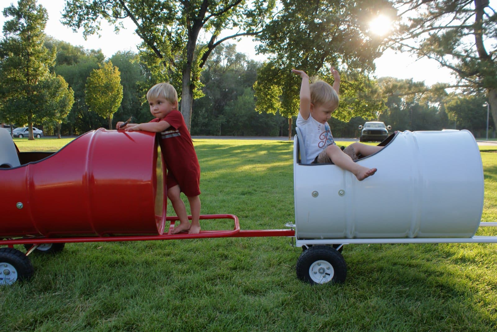 Kids riding the Backyard Barrel Express