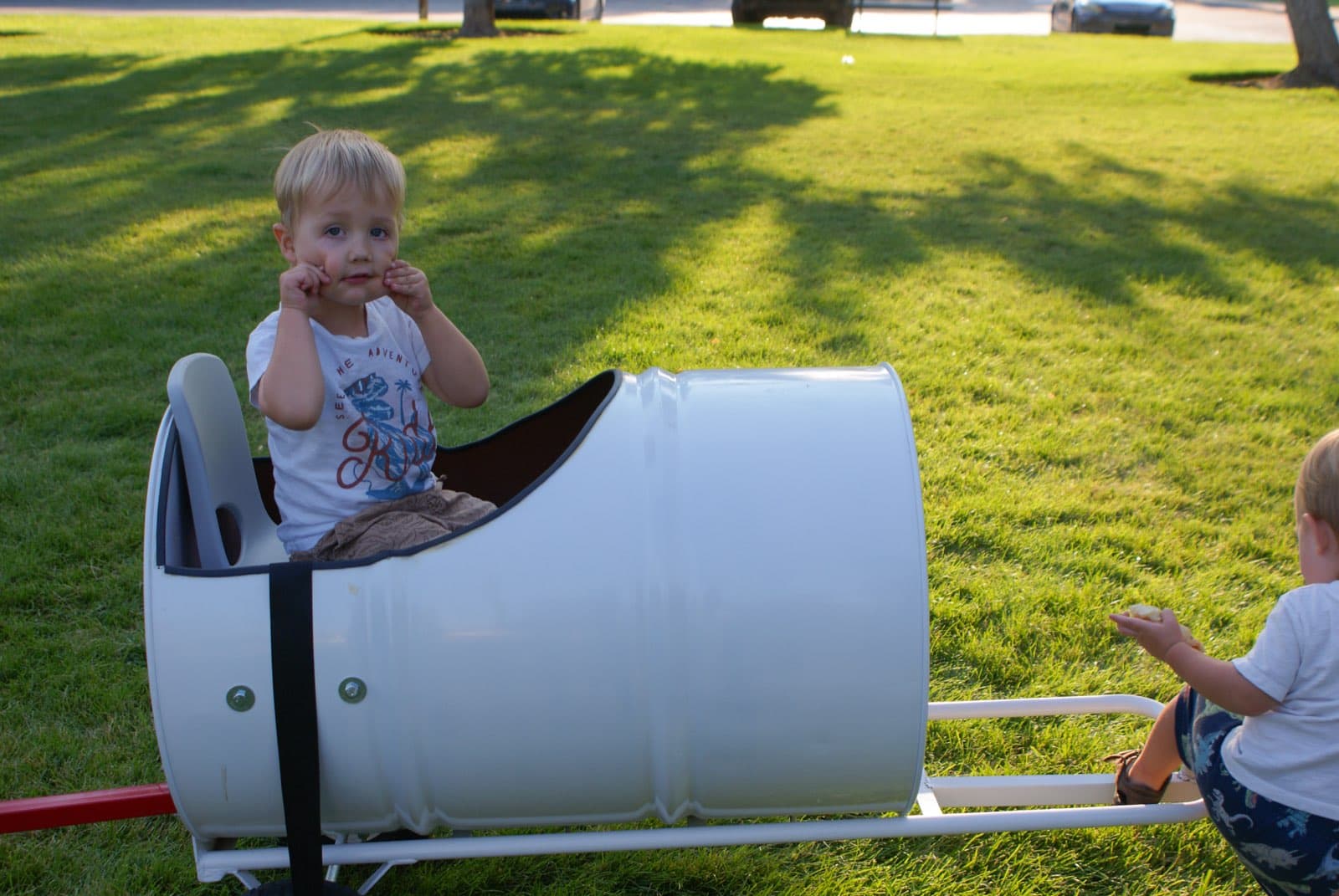Kids riding the Backyard Barrel Express