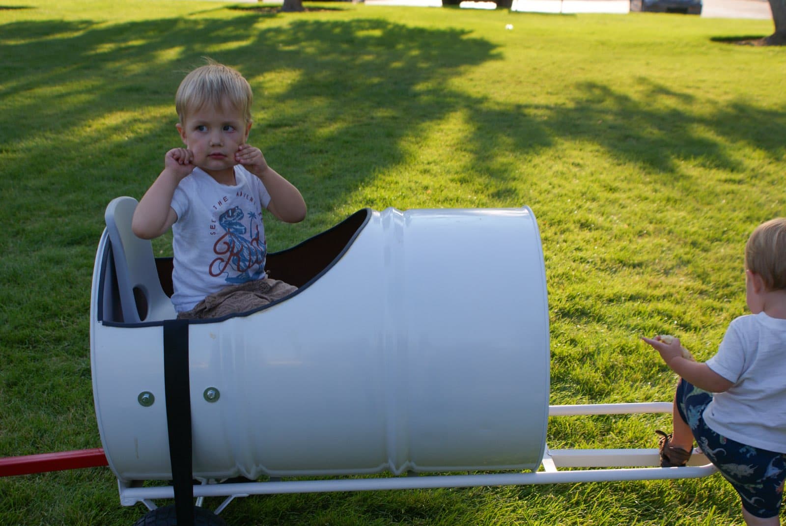 Kids riding the Backyard Barrel Express
